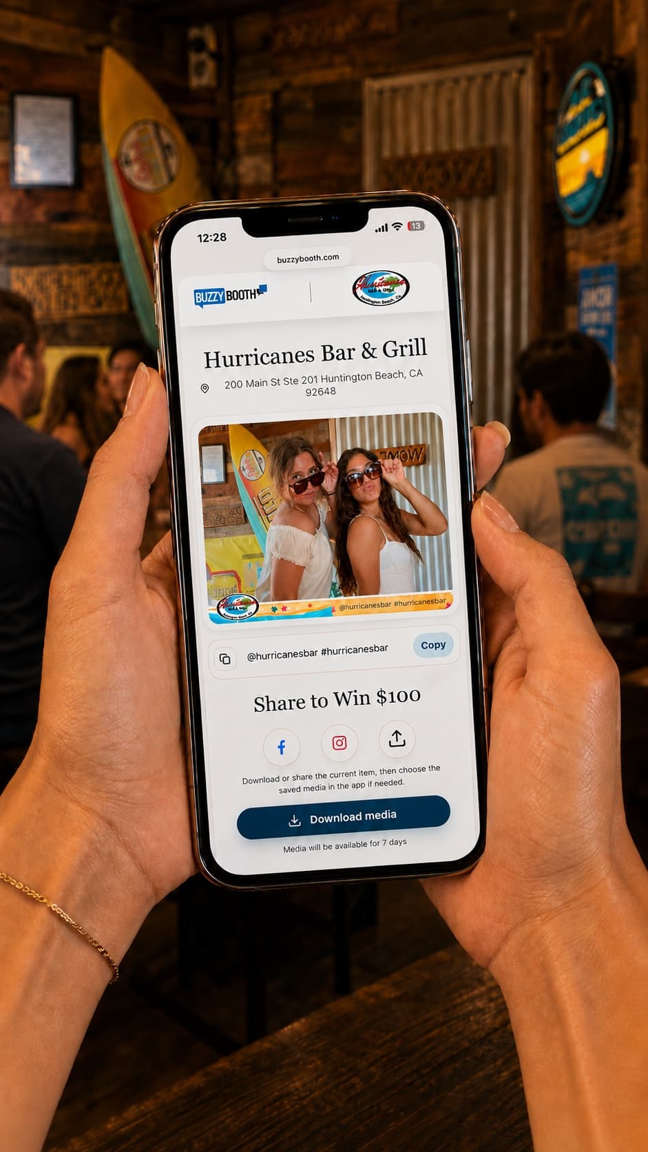 A guest viewing and sharing a Hurricanes Bar and Grill BuzzyBooth photo on their phone